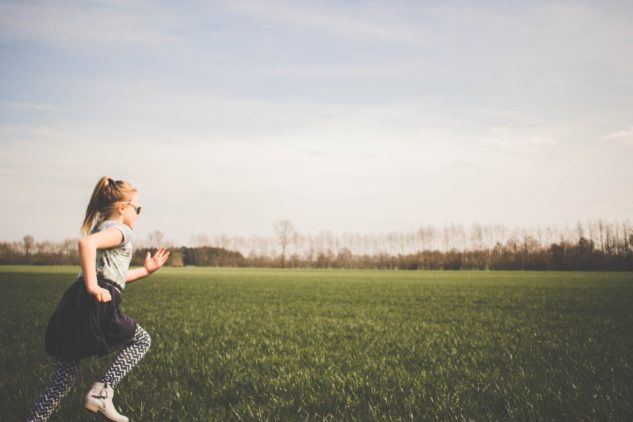 child running in a field