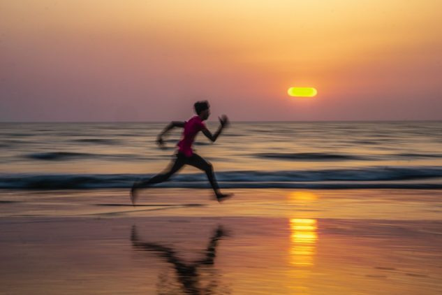 Sprinting man on a beach