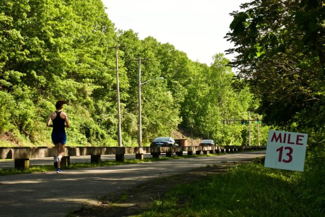 woman running 13 miles sign