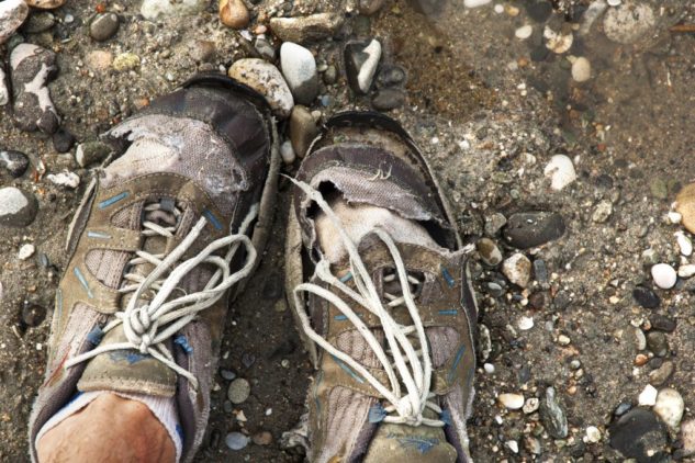 Old ripped running shoes