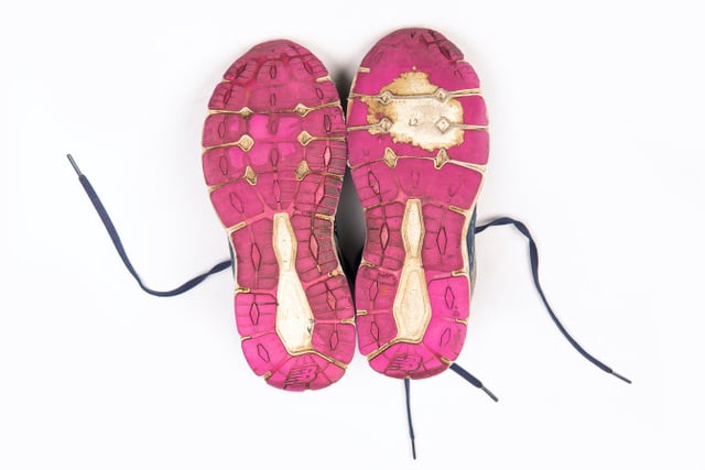 Soles rubbed out on one running shoe sole