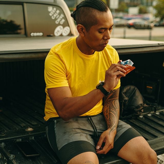 Runner sitting to eat and refuel