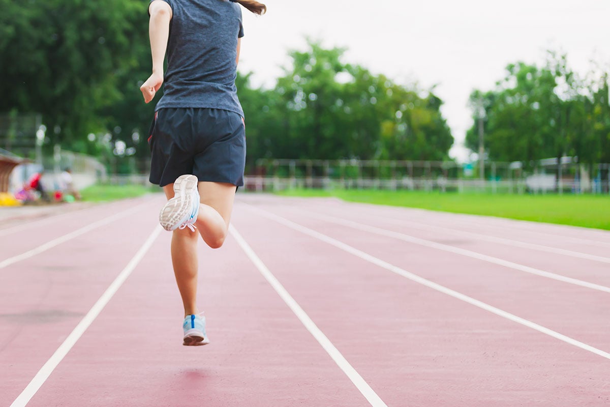 Someone running on a track 